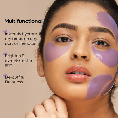 Woman with purple patches on her face against a beige background