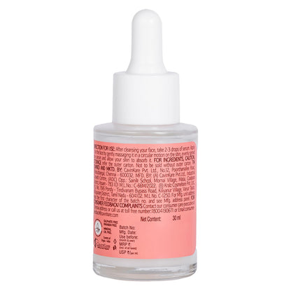 Skincare dropper bottle with pink label on a white background
