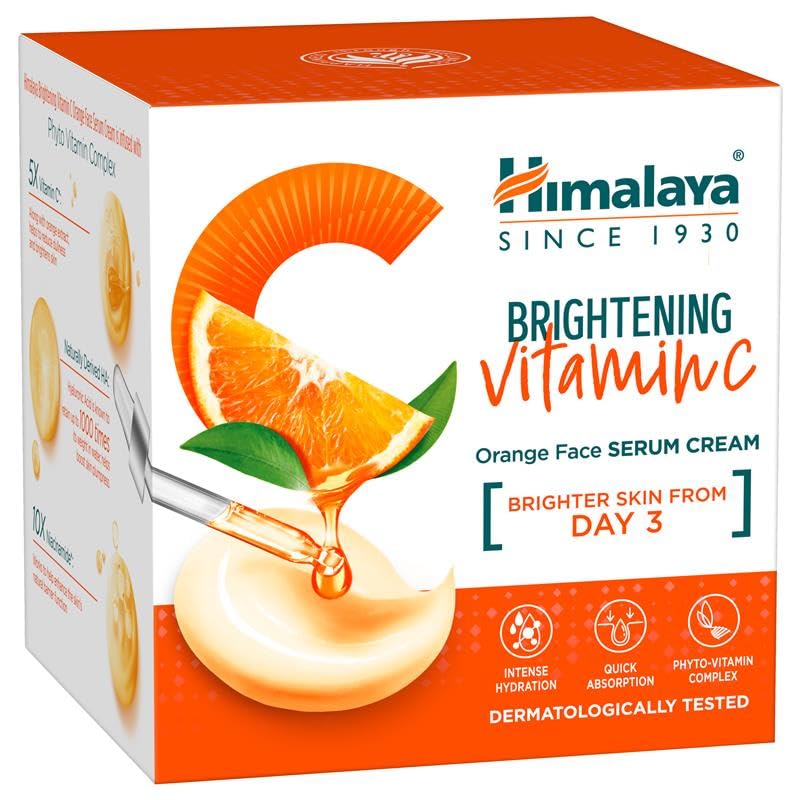 Himalaya Brightening Vitamin C Orange Face Serum Cream packaging with orange slices and cream illustration.