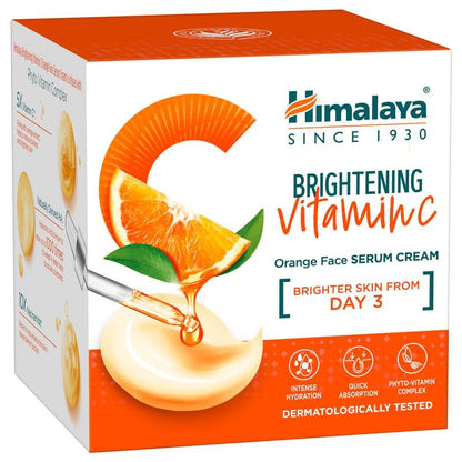 Himalaya Brightening Vitamin C Orange Face Serum Cream packaging with orange slices and cream illustration.