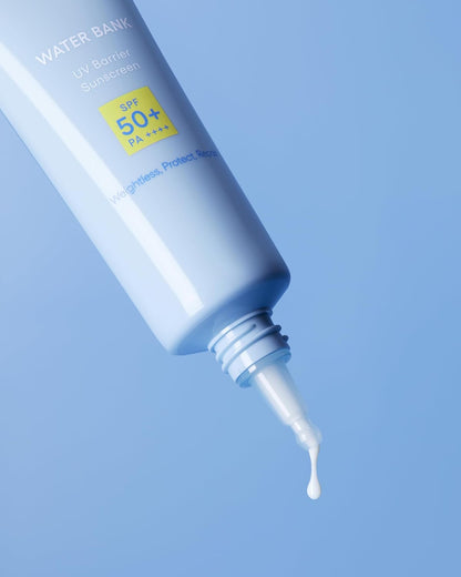 Sunscreen cream being squeezed from a tube with a blue background