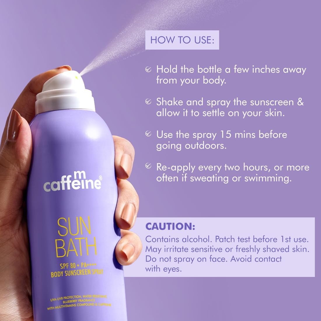 Hand holding a purple sunscreen spray bottle labeled 'cafe m caffeine Sun Bath' with usage instructions on a purple background.
