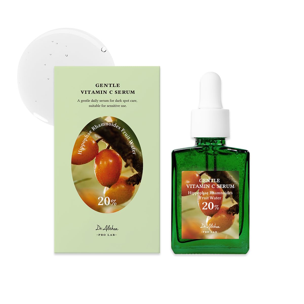 Green vitamin C serum bottle with packaging on a white background