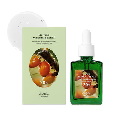 Green vitamin C serum bottle with packaging on a white background