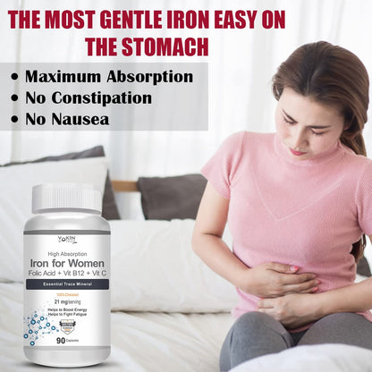 Bottle of Iron for Women supplement with a woman experiencing stomach discomfort on a couch.
