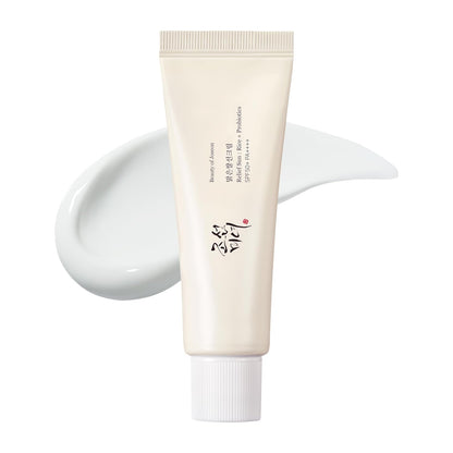 Tube of skincare product with white cream on a white background