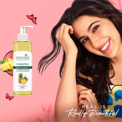Biotique Pineapple Oil Control Face Wash with a woman on a pink background