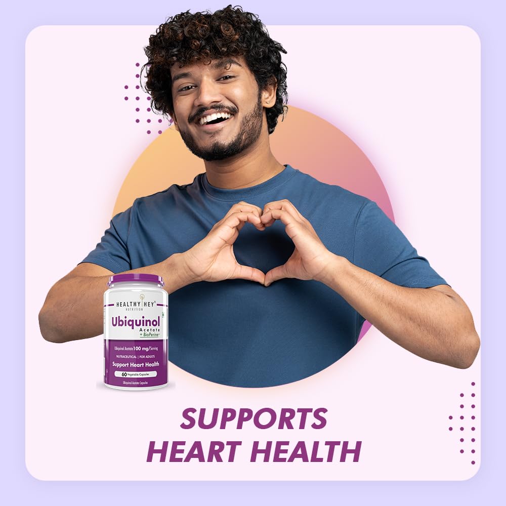 Man making a heart shape with his hands holding Ubiquinol supplements against a light purple background