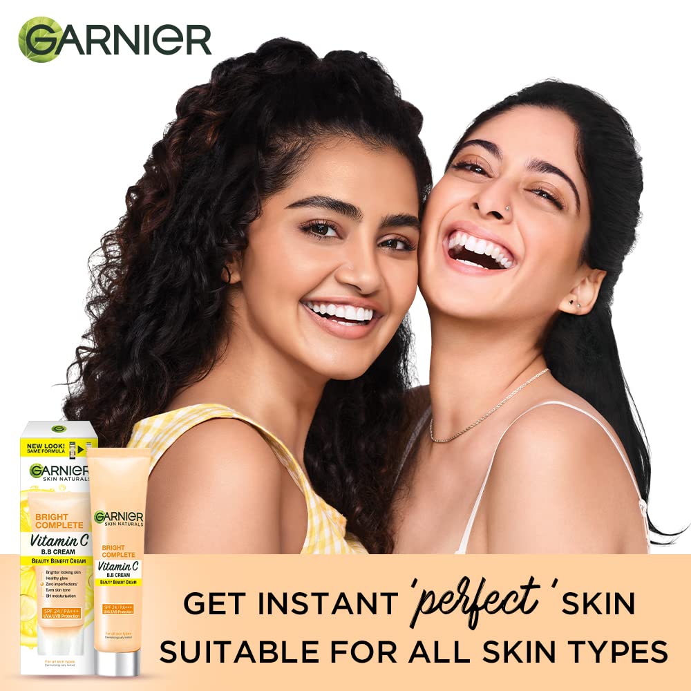 Two women smiling with Garnier skincare products in the foreground.