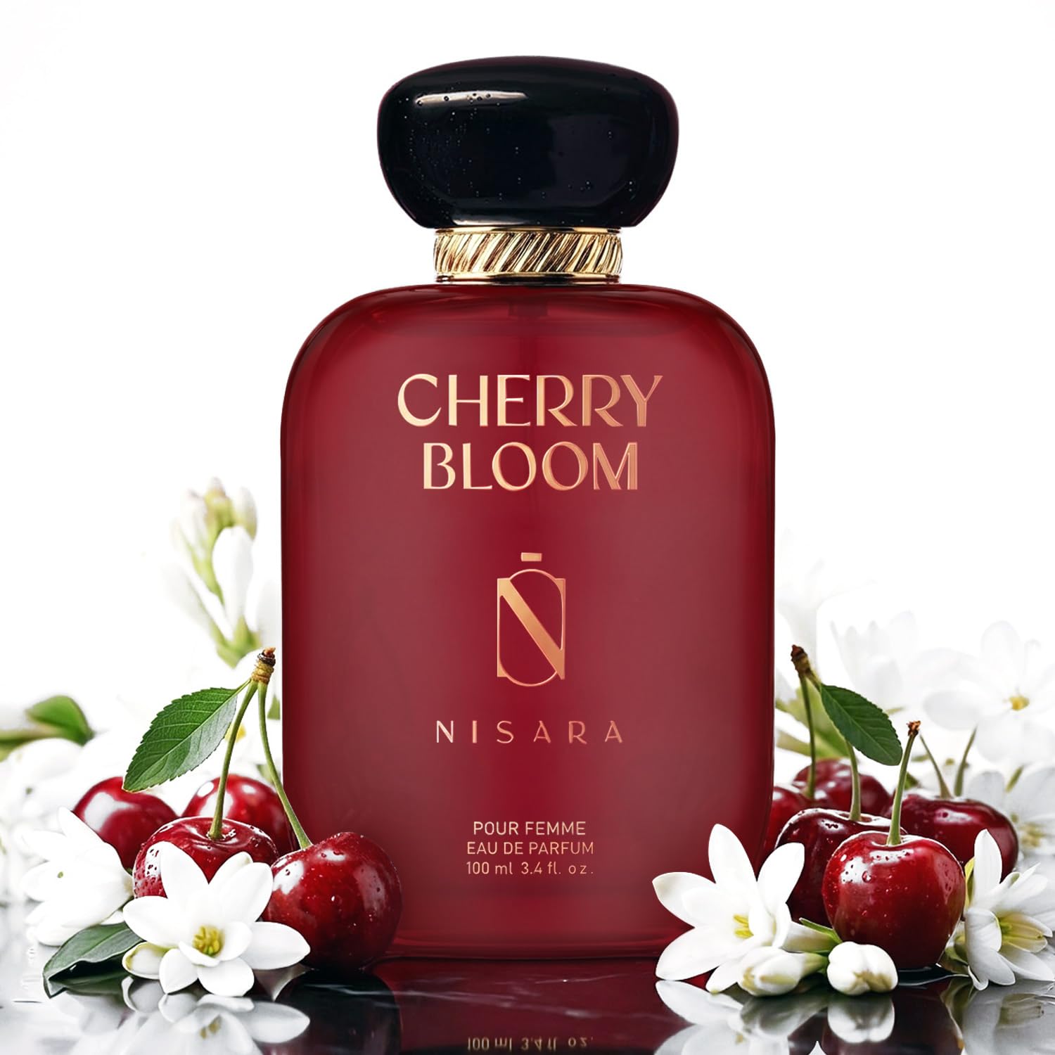 Red perfume bottle labeled 'Cherry Bloom' by Nisara with cherries and flowers on a white background