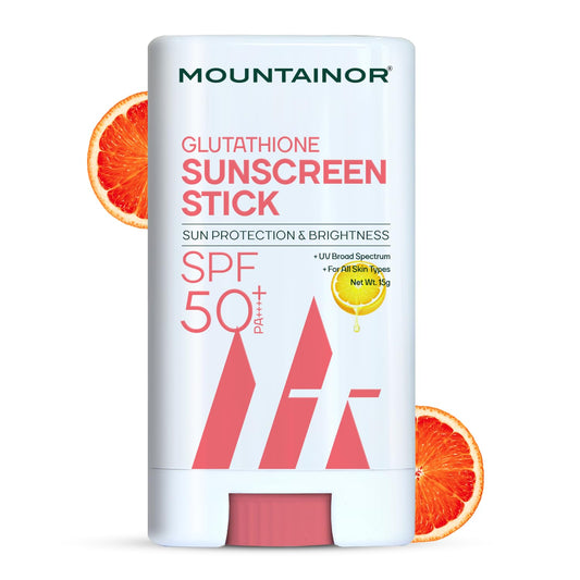 Mountainor Glutathione Sunscreen Stick SPF 50+ with grapefruit slices on a white background
