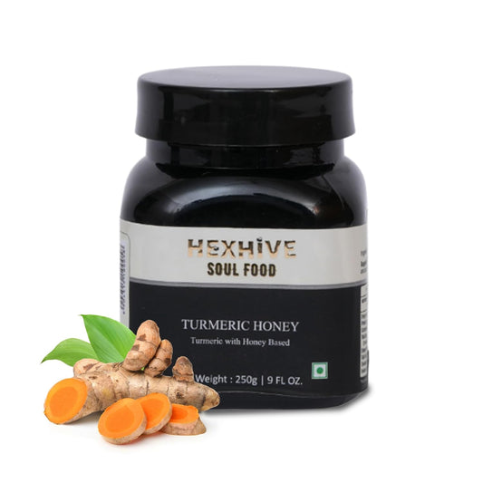 Hexhive Turmeric Honey jar with turmeric roots and honeycomb on a white background