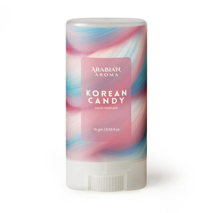 Solid perfume stick with colorful packaging labeled 'Korean Candy' by Arabian Aroma on a white background.
