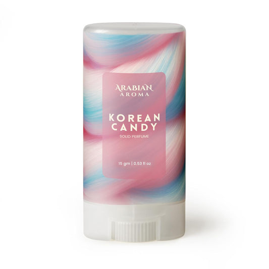 Solid perfume stick with colorful packaging labeled 'Korean Candy' by Arabian Aroma on a white background.