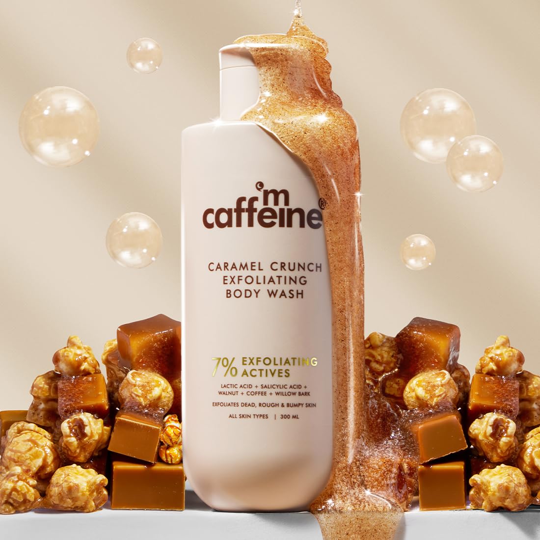 Caffeine Caramel Crunch Exfoliating Body Wash with caramel crunch elements on a beige background