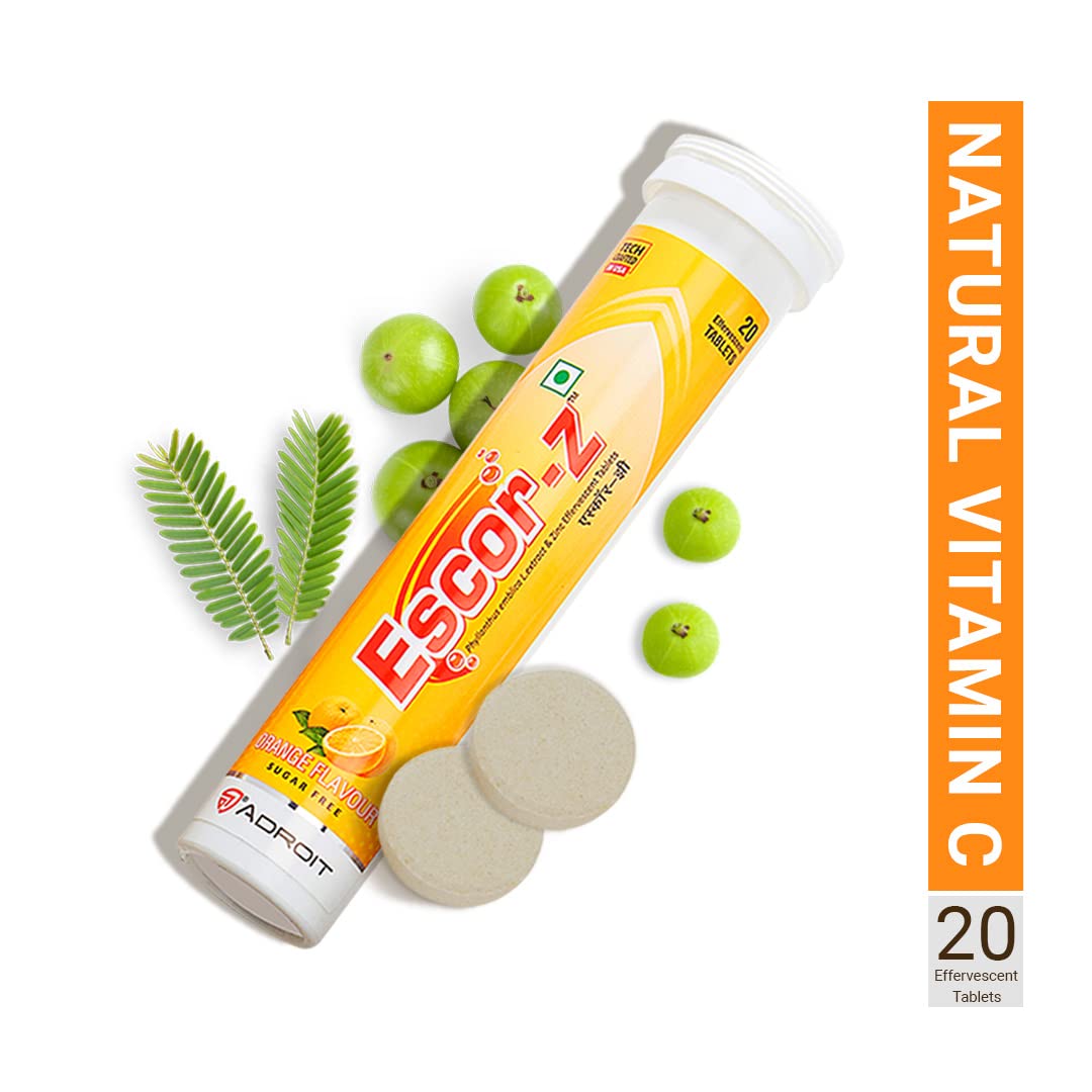 Escor-Z natural vitamin C supplement with green fruits and leaves on a white background