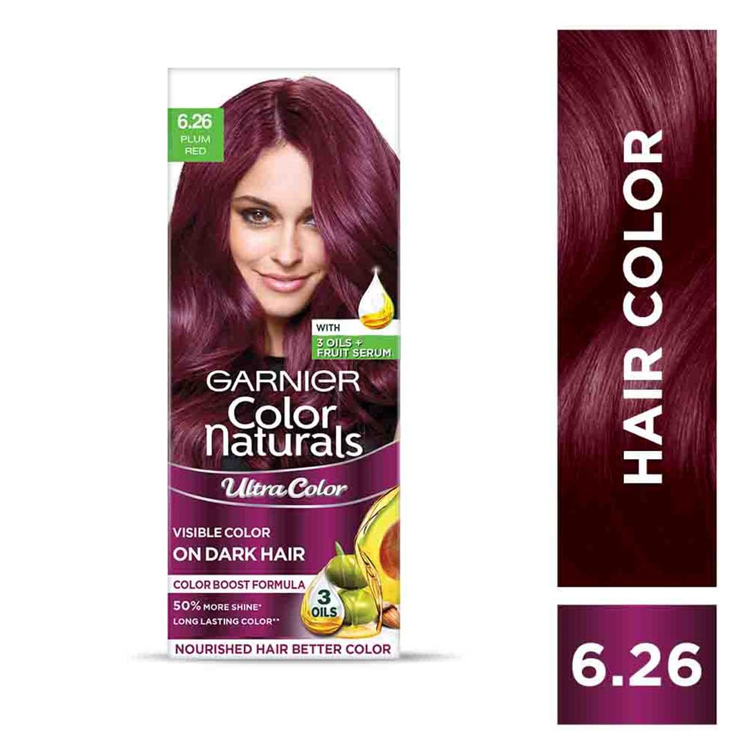 Garnier Color Naturals hair color kit with a woman's face and product packaging on a white background.