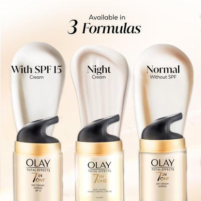 Three Olay Total Effects skincare products with labels for SPF 15, Night, and Normal on a beige background.