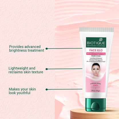 Biotique Face Glo cream tube with text on a pink background