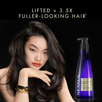 Woman with voluminous hair next to a Nexxus shampoo bottle on a black background