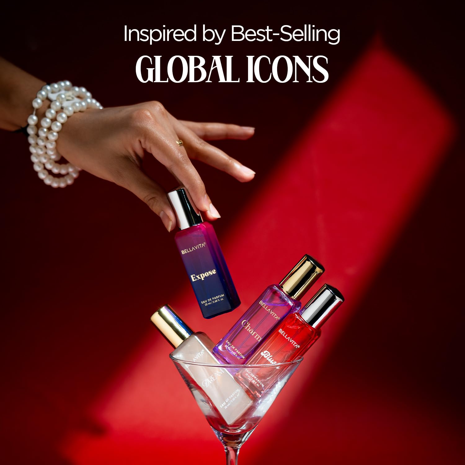 Perfume bottles with a hand holding one, set against a red background with text about inspired global icons.