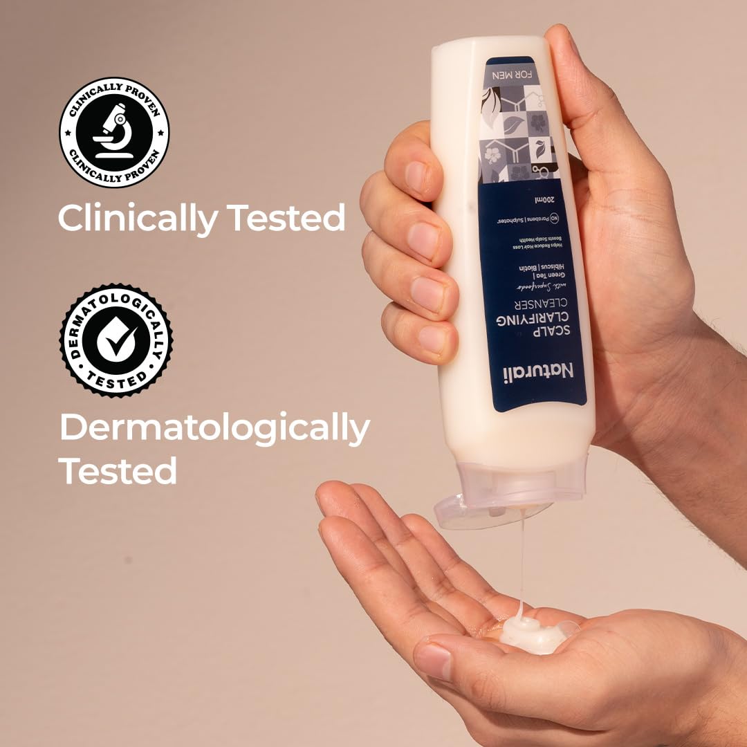 Hand holding a tube of Natiwel skincare product with 'Clinically Tested' and 'Dermatologically Tested' labels.