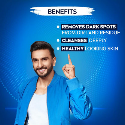 Man in blue jacket pointing to text on a blue background with skincare benefits listed.