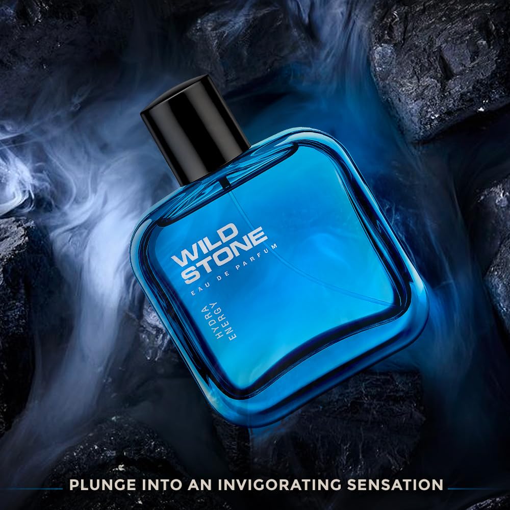 Blue Wild Stone perfume bottle on a dark background with smoke effect