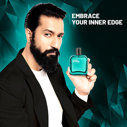 Man holding a blue perfume bottle with 'Embrace Your Inner Edge' text on a geometric patterned background