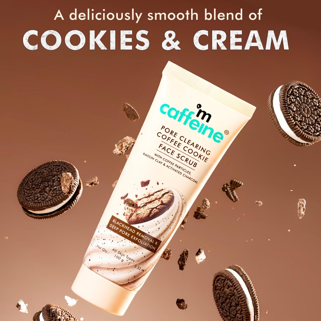 Tube of Mcaffeine cookies and cream face scrub with Oreo cookies on a brown background