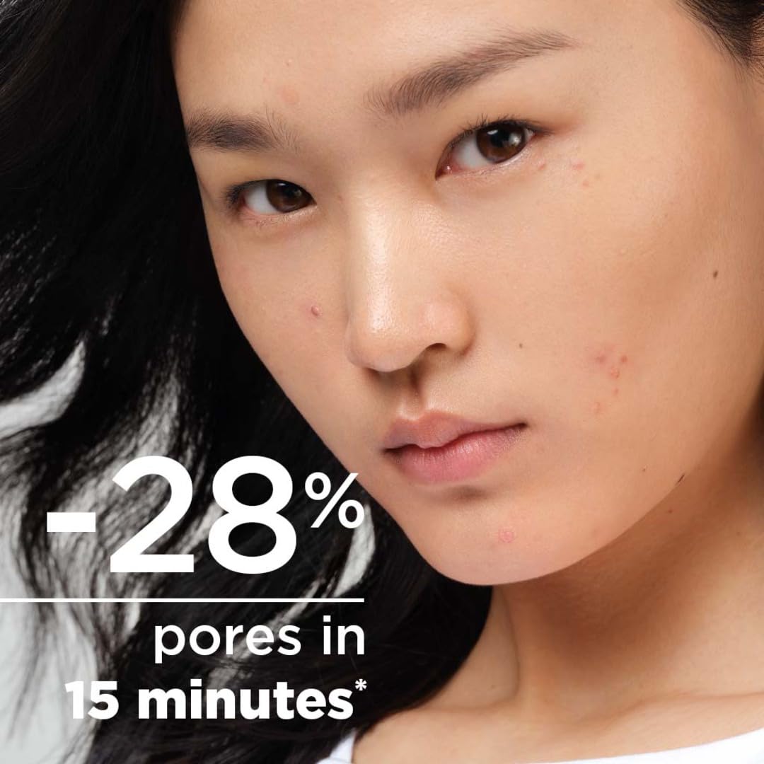 Woman with black hair and visible pores, text indicating 28% reduction in pores in 15 minutes.
