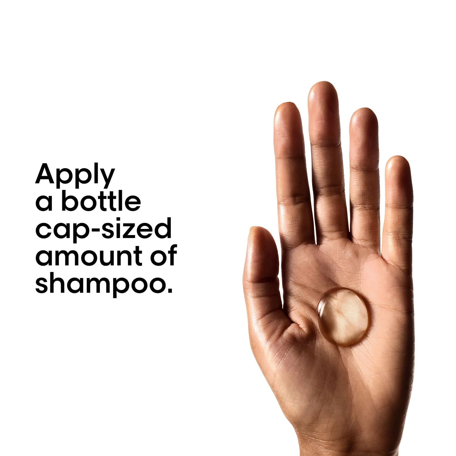Hand holding a small amount of shampoo with text on a white background