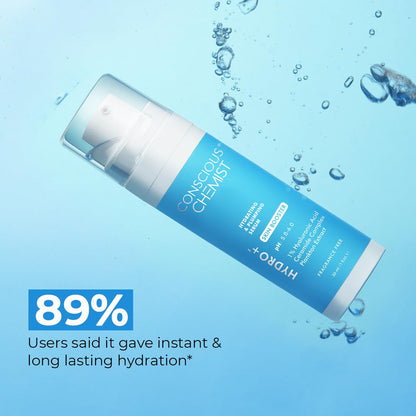 Tube of conscious chemist skincare product with water droplets on a blue background