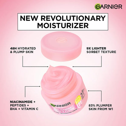 Garnier moisturizer jar with pink sorbet texture on a pink background