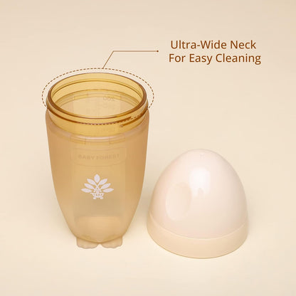 BPA-free baby bottle with ultra-wide neck for easy cleaning on a beige background
