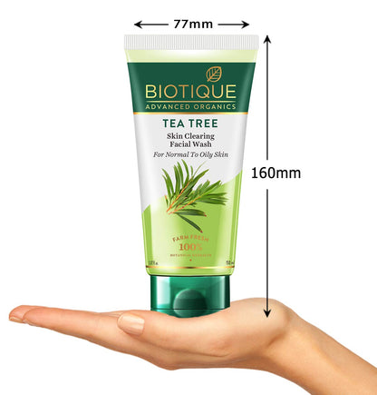 Biotique Tea Tree Skin Clearing Facial Wash tube held in a hand with dimensions indicated.