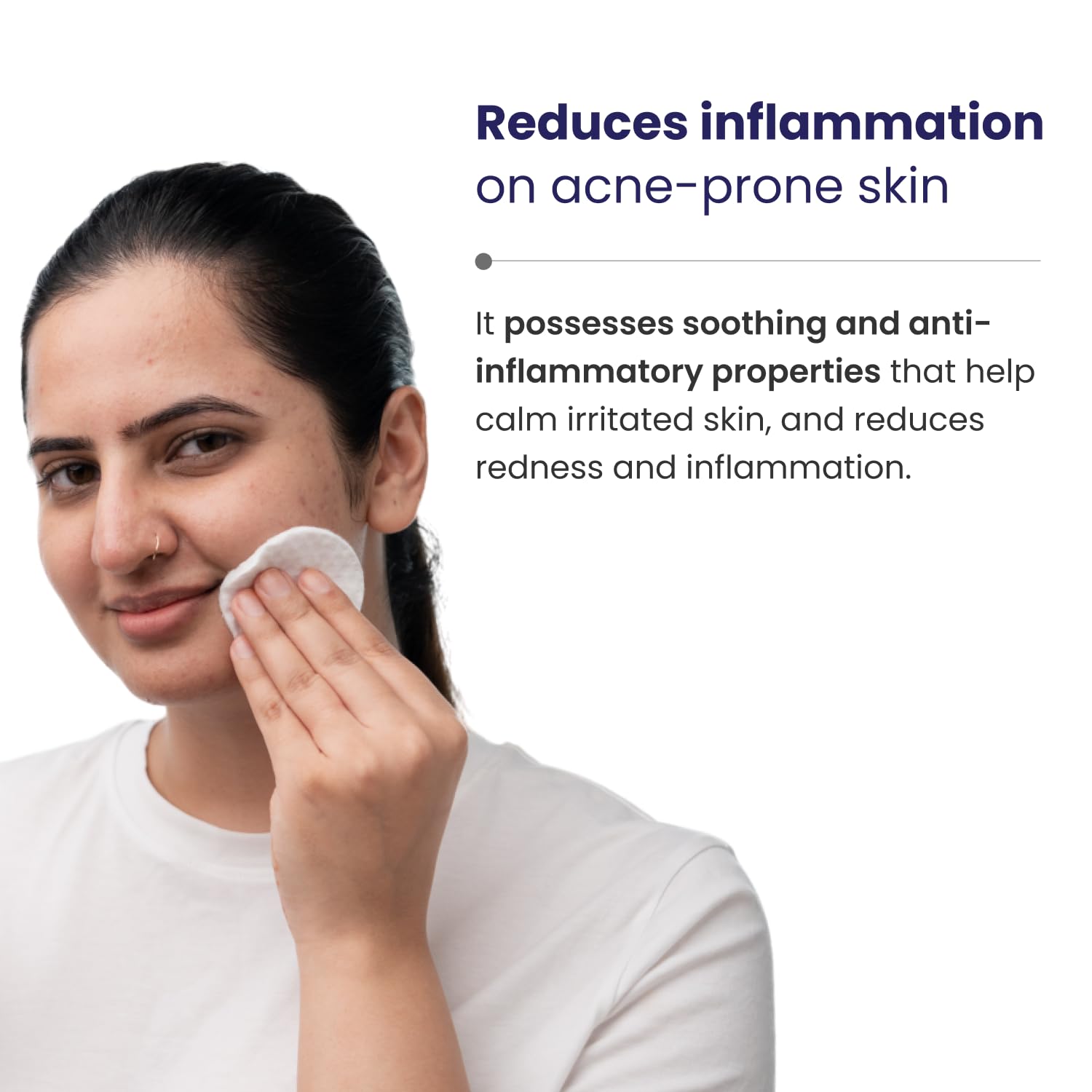 Woman applying a product to her face with text about reducing inflammation on acne-prone skin.