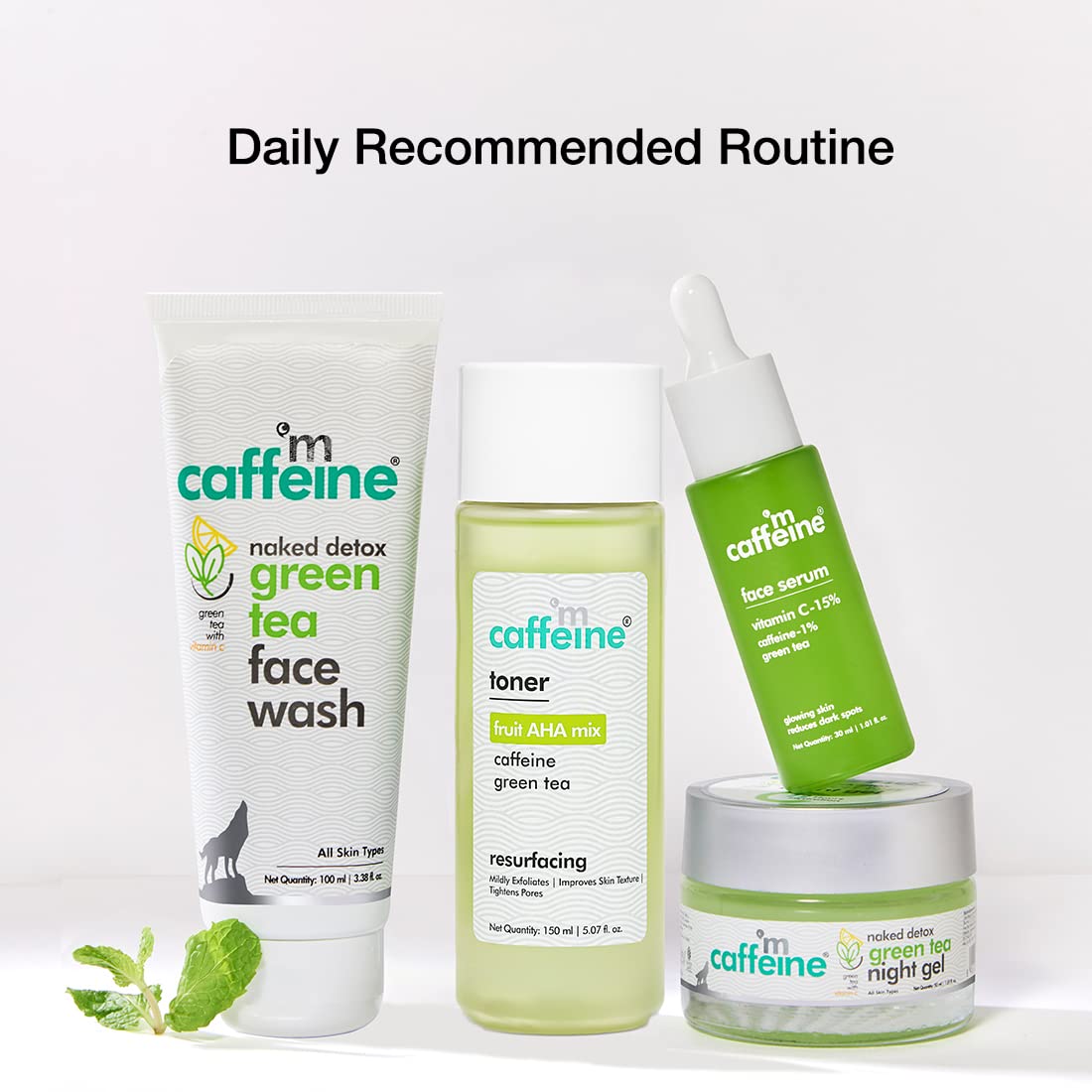 Set of 'm caffeine' skincare products including face wash, toner, serum, and night gel on a white background.