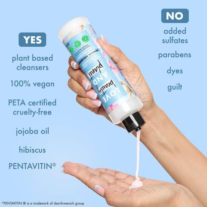 Hand holding a bottle of cleanser with text highlighting its benefits on a blue background