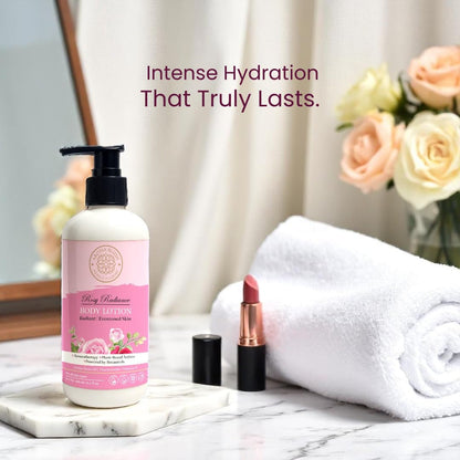 Body lotion bottle with pink label, lipstick, and towel on marble surface with flowers in the background.