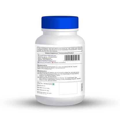 White supplement bottle with blue cap on a white background