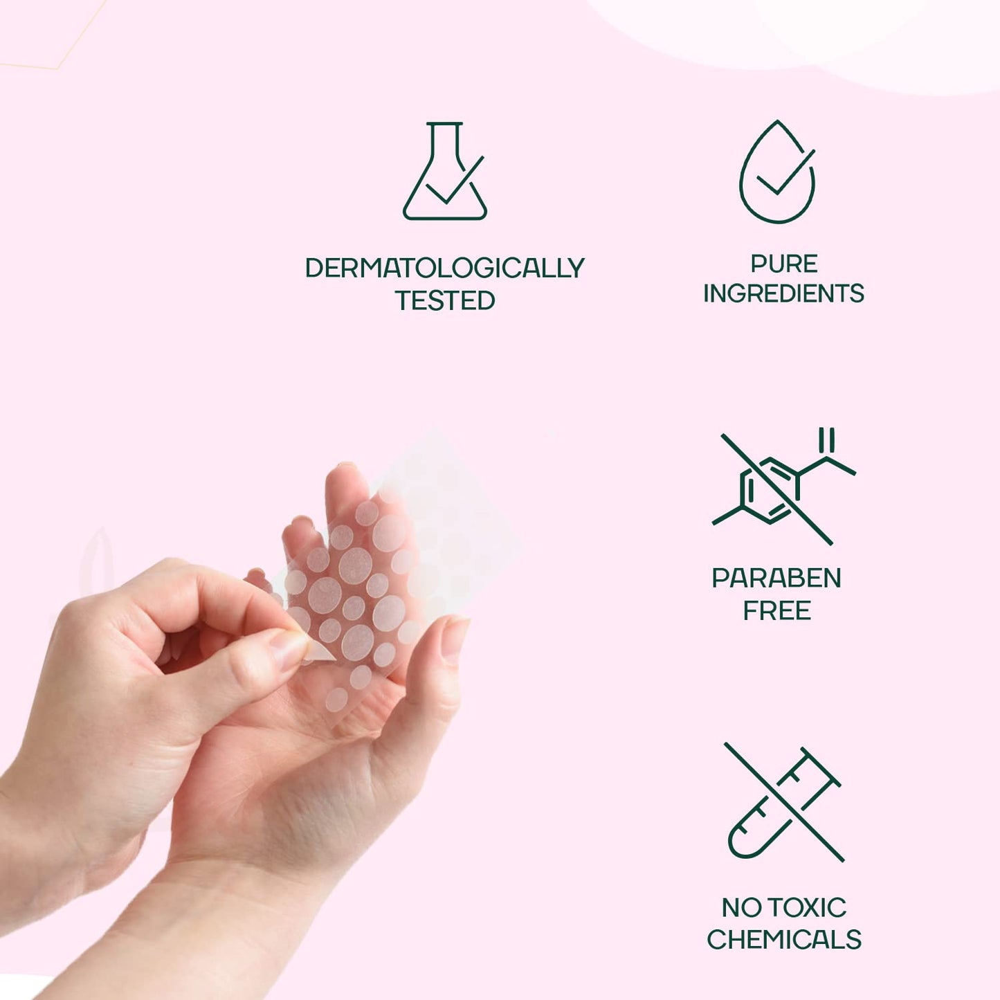 Hand holding a sheet of dots with icons and text indicating product features on a pink background