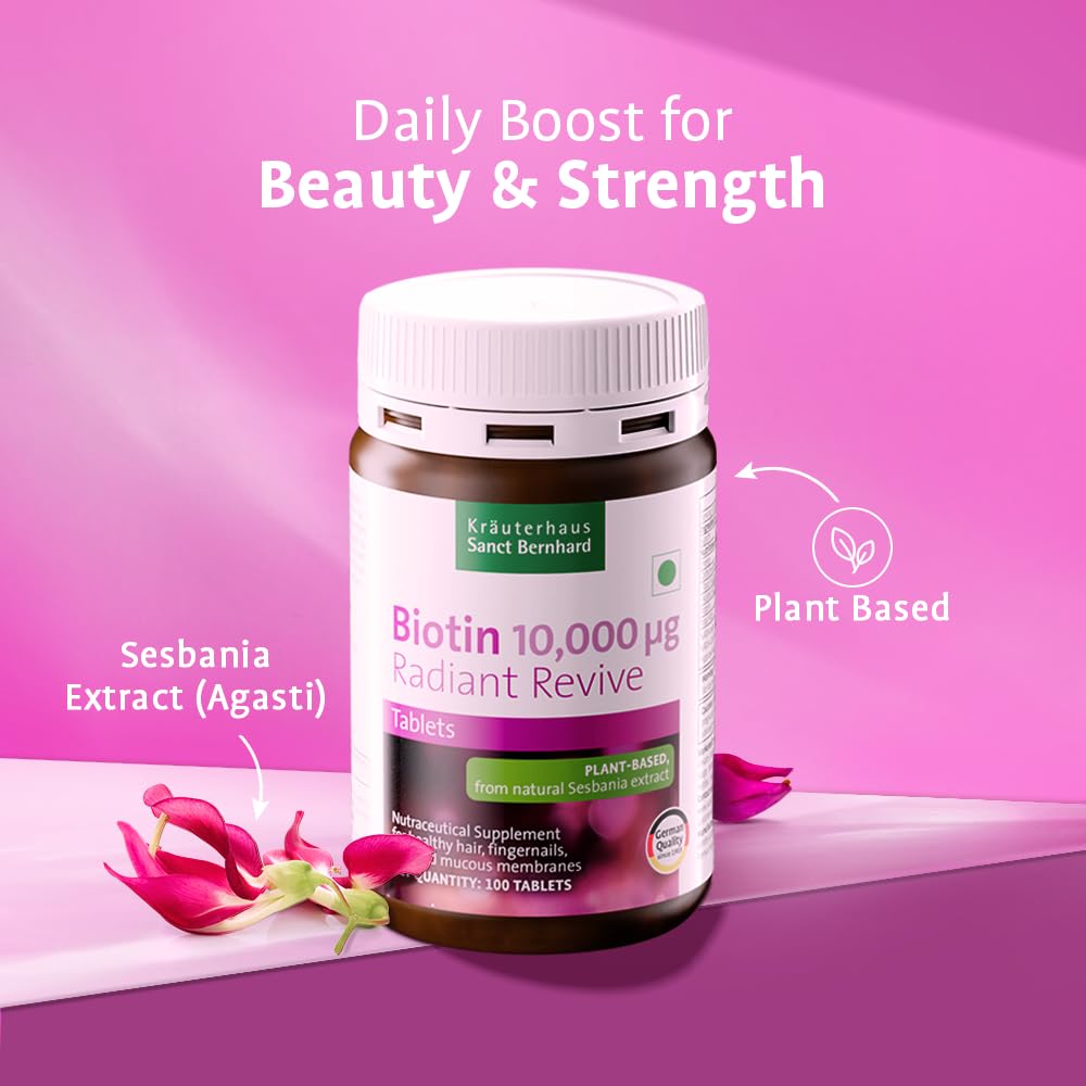 Bottle of Biotin supplements with pink flowers on a pink background