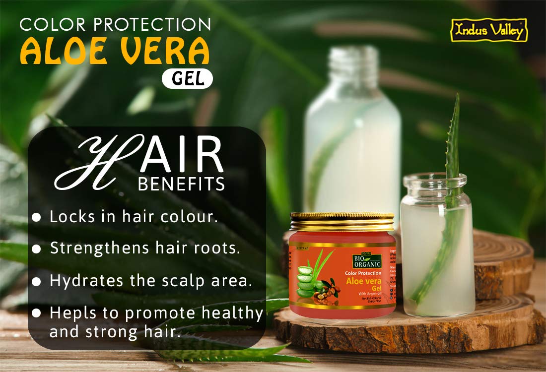 Aloe vera gel with air benefits text on a wooden surface with greenery in the background