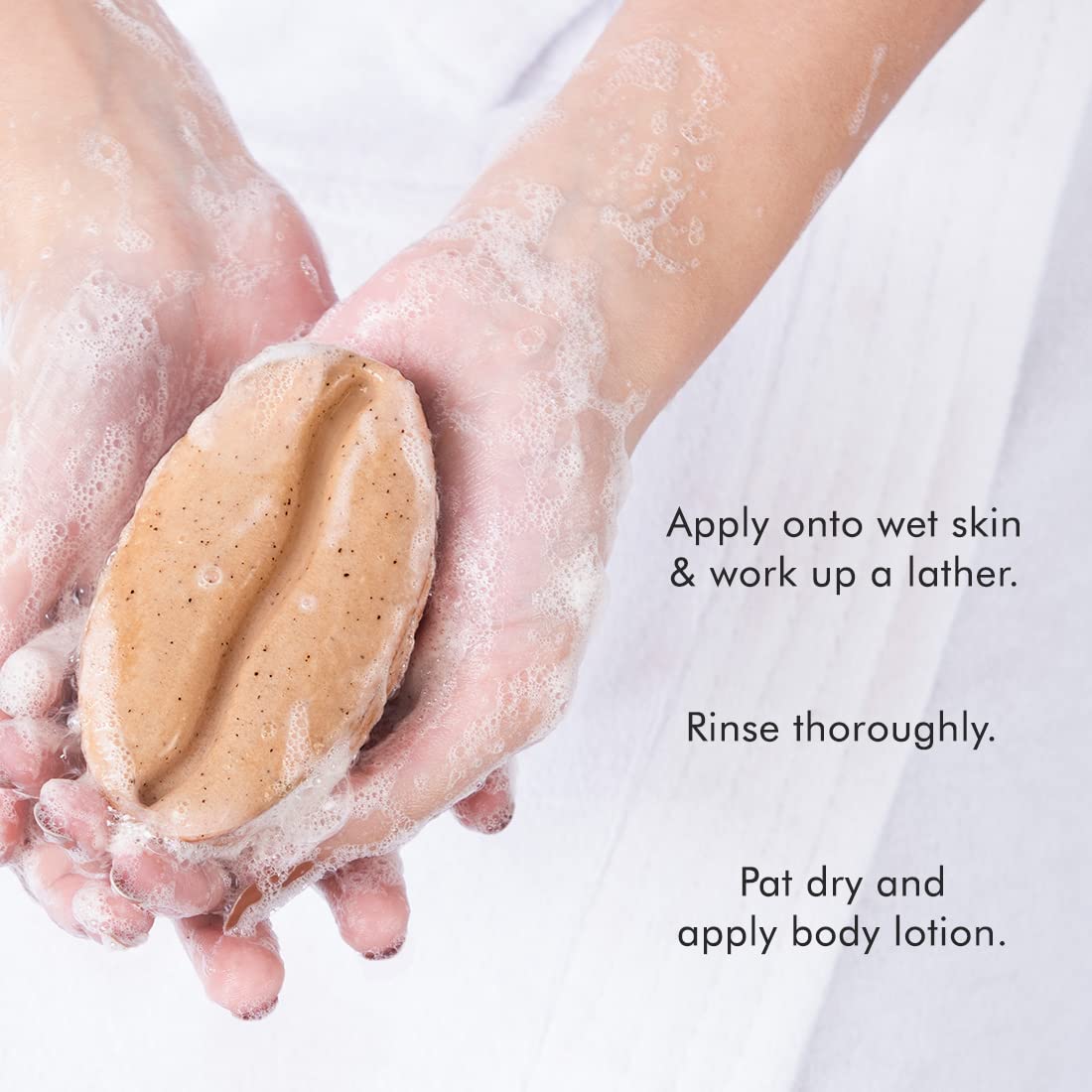 Hands holding a bar of soap with text instructions on a white background