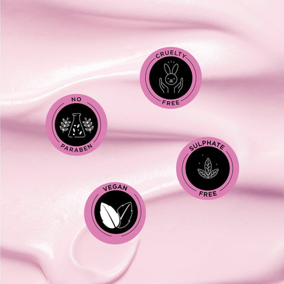 Set of four pink circular icons with black text and symbols on a pink fabric background