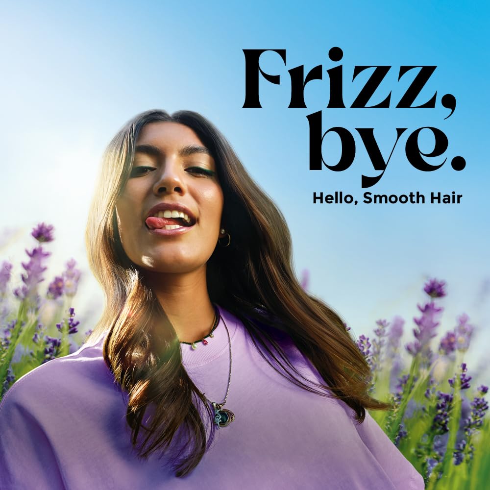 Woman with smooth hair in a field of lavender with 'Frizz, bye. Hello, Smooth Hair' text.
