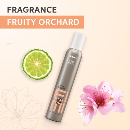 Wella EIMI hair product with lime and flower on a beige background