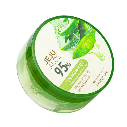 Jar of Jeju Aloe 95% gel with aloe vera leaves on a white background