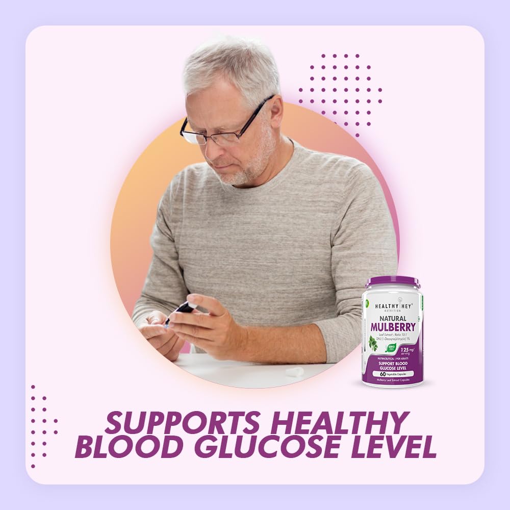 Man using a smartphone with a bottle of 'Healthy Herb Natural Mulberry' supplement on a light purple background.